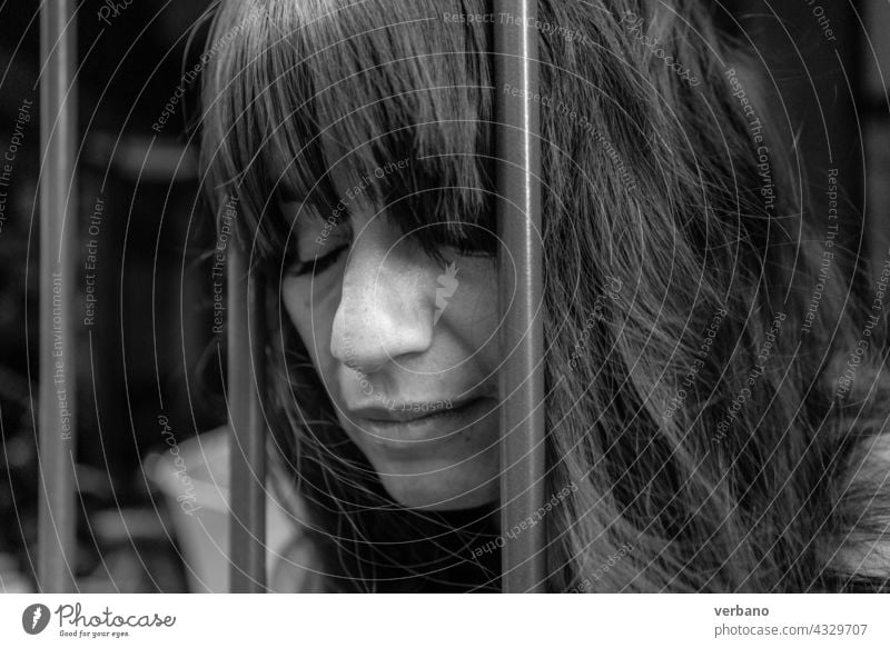 monochrome bw portrait of a woman between iron bars beautiful female beauty happy smile black person happiness face ethnic background american pretty studio