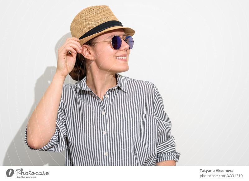 Smiling woman in hat and sunglasses person summer female happy vacation caucasian adult lifestyle cheerful looking smiling brunette smile straw carefree enjoy