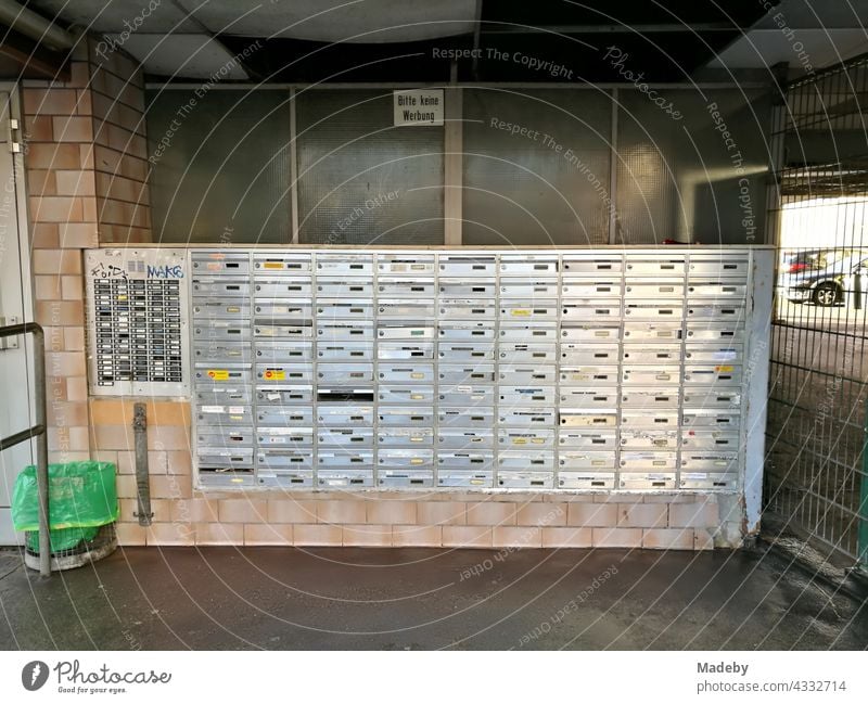 Mailbox system on a large apartment building in the city centre of Offenbach am Main in Hesse Letter (Mail) letterbox system Brass Metal splendour