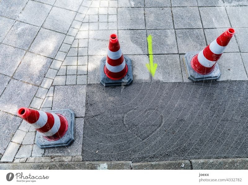 Building site love Construction site Love Heart off pavement Relationship Work esteem Arrow Colour photo guiding cone Pylons repair Repair mended Sign symbol