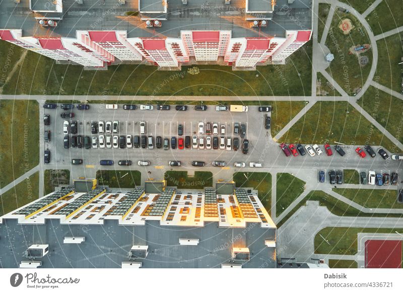 Aerial view of car parking lot near modern house building residential yard transport living sector parking space vehicle outdoor top asphalt street urban vacant