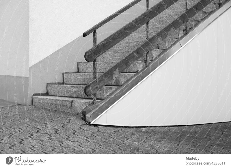 Staircase with wooden railing along a wooden wall at a twete in the old town of Oerlinghausen at the Hermannsweg near Bielefeld in the Teutoburg Forest in East Westphalia-Lippe, photographed in traditional black and white