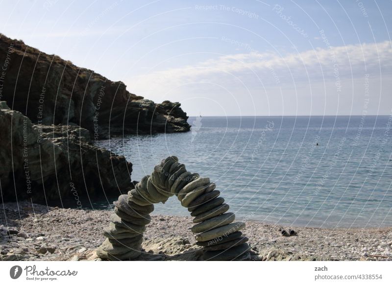 Interspaces | Architecture Beach Ocean coast Water Cairn Island Cyclades Folegandros Greece the Aegean Mediterranean sea Blue Rock Hill Sky