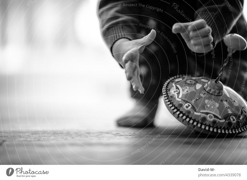 Kid grabs his toy Child hands Playing Toys Gyroscope Infancy Joy Enthusiasm Employment Cute floor Grasp