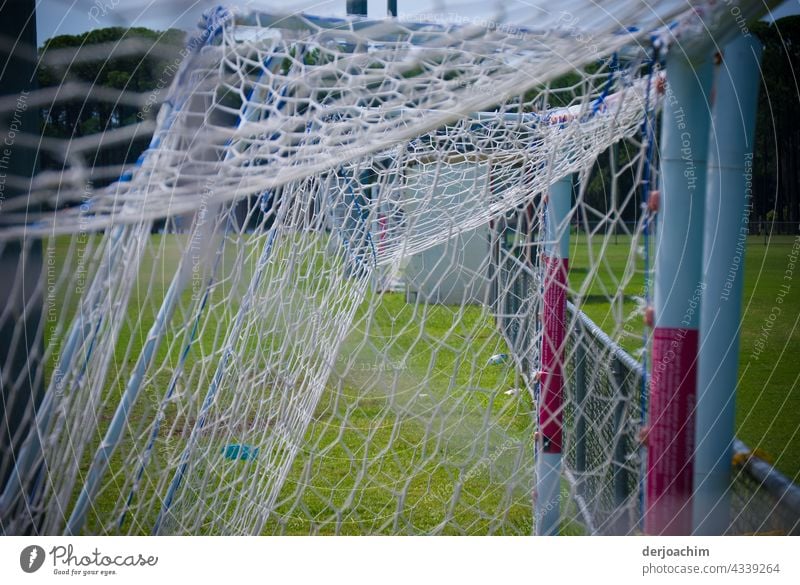 The goals were placed together at the edge of the field after practice. Goal Colour photo Deserted Day Architecture Exterior shot Net Leisure and hobbies