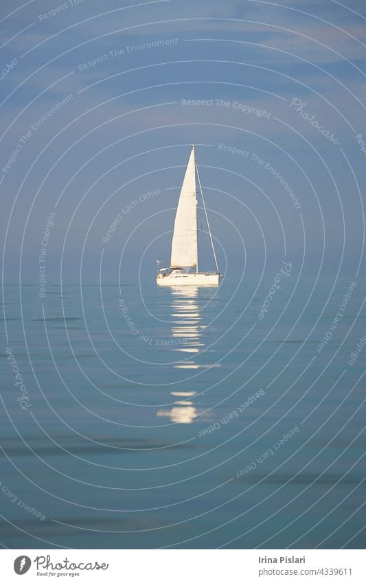 A yachts in the sea. beautiful blue boat bright cloud colorful creepy cruise england europe exhalation fishing fog harbor harbour haze holiday horizon horror