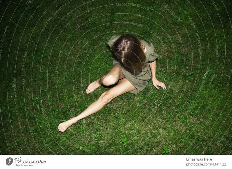 All is green, all is fun. Summertime is all about it. Like this gorgeous brunette girl on lying green grass. Can’t see her face, though her long and pretty legs take up all the space in this image.