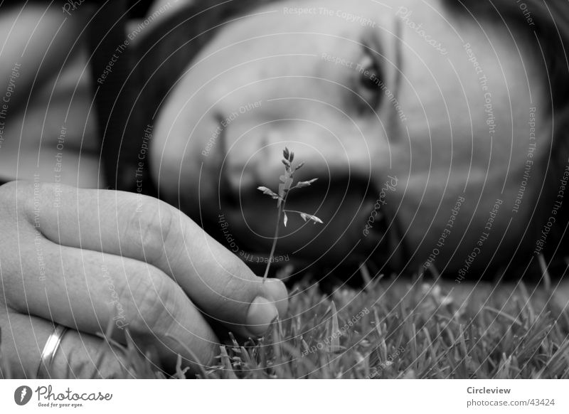 Not really sad. Woman Black White Grass Blade of grass Fingers Hand Grief Portrait photograph Black & white photo Lawn Head Face Sadness Circle Looking