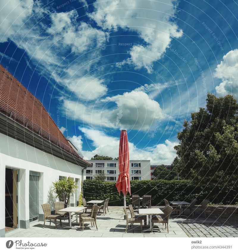 Somewhere Gastronomy Seating chairs tables Empty Appealing Café Sky Clouds Deserted Exterior shot Colour photo Copy Space top Long shot Sunlight Contrast Light