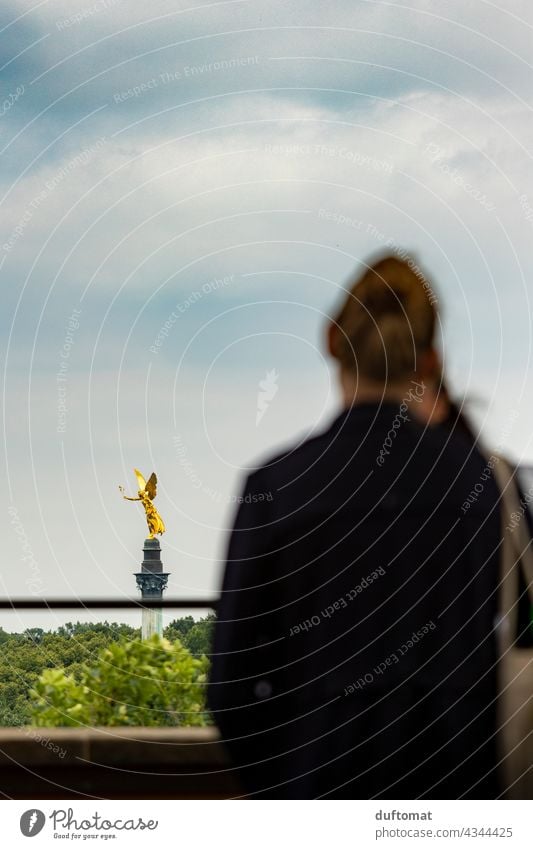 Woman looks at Munich peace angel Tourism Angel Angel of peace Bavaria Gold golden outlook enjoying the view Far-off places Home country Clouds