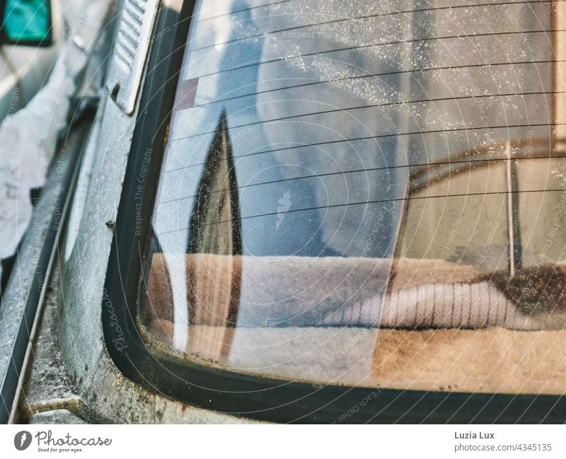 Close-up inside an old Trabant through the window, lights and reflections decay Old car trobant Trabbi Destruction Ravages of time dilapidated Beige Gloomy sad