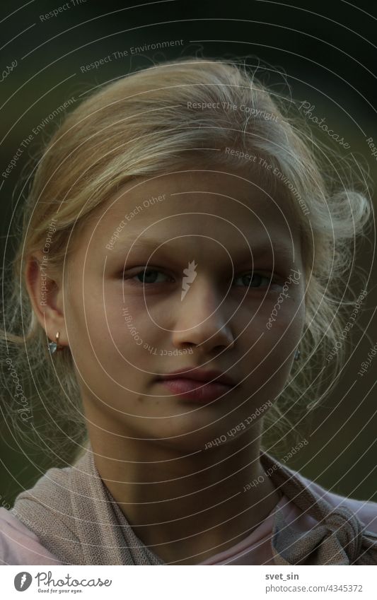 Portrait of a blonde girl in the evening light outdoors. portrait face teenager summer looking at camera natural dreaming rural alone youth happy posing