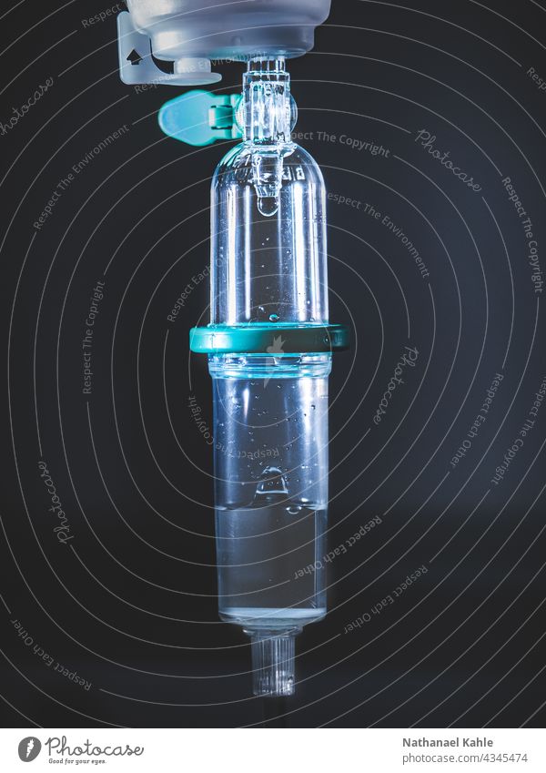 Drip chamber of an infusion system medicine Hospital Medication dark Health care Colour photo Healthy Illness Blue Doctor Medical treatment clinic Nurse