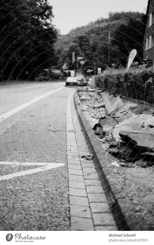 Flood-damaged pavement in Volmetal (Hagen, NRW) Doom flood disaster High tide damages Damage cataclysm Destruction Broken peril Water damage Climate change