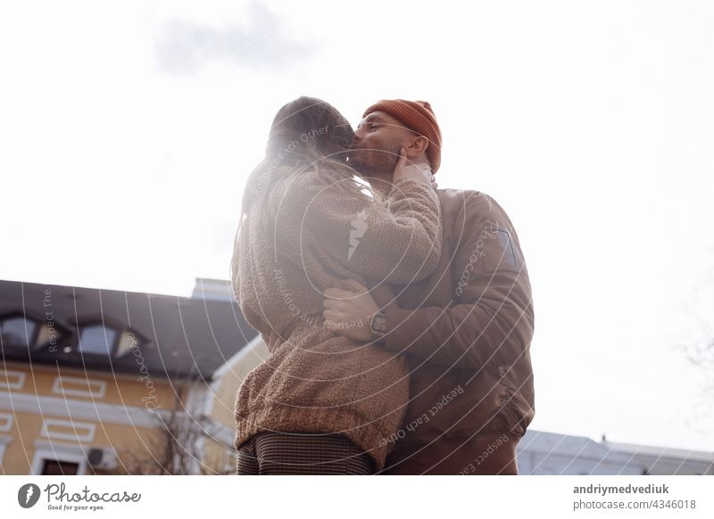 Beautiful Tourist Couple In Love Walking On Street Together. Happy Young Man And Smiling Woman Walking Around Old Town Streets, Looking At Architecture. Travel Concept.