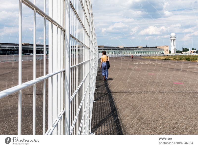 You can walk across the former airfield for a long time, but the fence prevents unauthorized entry into the last security areas Airport Tempelhof Berlin