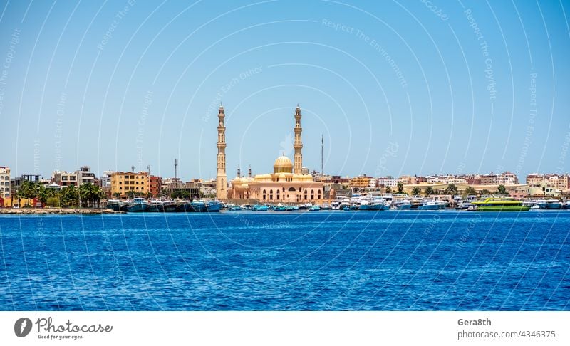 many ships in the Hkrgada Marina in the Red Sea Africa Hurghada bay beach blue blue sky blue water boat boat trip boats boats tied coast coastline cruise egypt