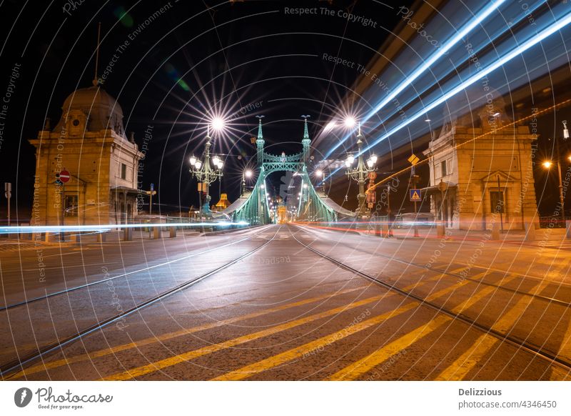 Freedom Bridge in Budapest in the evening time, long exposure with lights from traffic freedom bridge brige Szabadság híd hidden Hungary Europe Illuminated