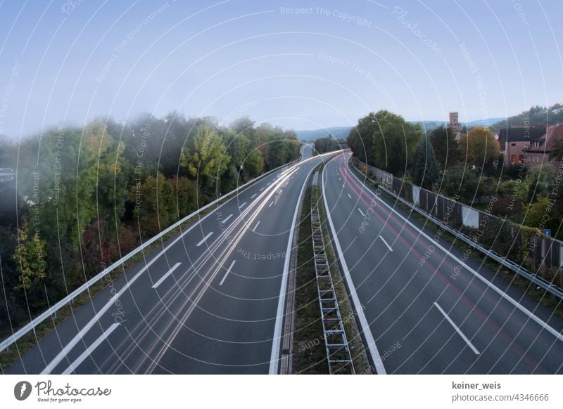 Two-lane federal highway with streaks of headlights in long time exposure car Highway Federal highway Long exposure B469 Obernburg Elsenfeld Highway ramp (exit)