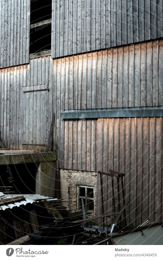 Beautiful old rustic facade of weathered wood of a barn on a farm in Rudersau near Rottenbuch in the district of Weilheim-Schongau in Upper Bavaria Wood Brown