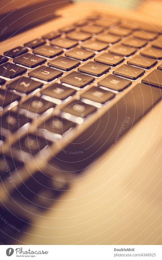 Laptop keyboard with low depth of field and color effect blurriness shallow depth of field Close-up Deserted Work and employment Computer keyboard Home Office