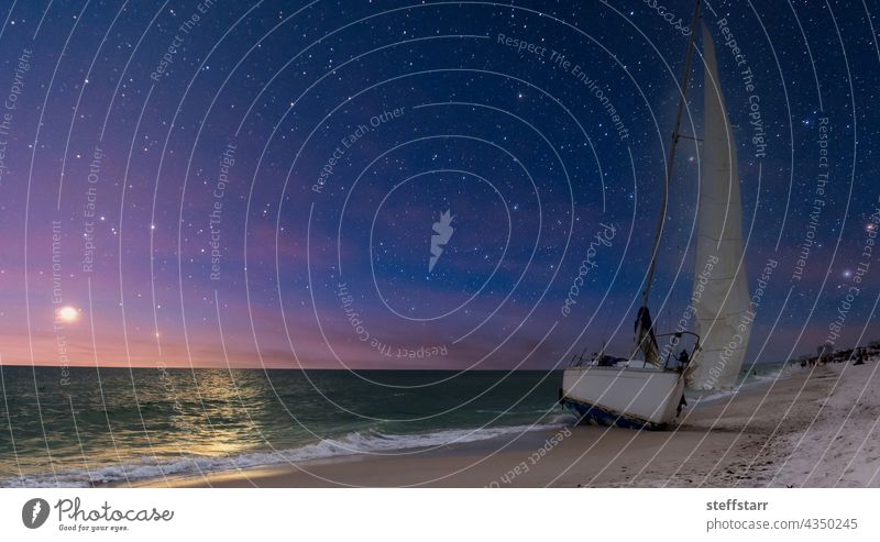 Night sky over shipwreck on the coast of Clam Pass in Naples Shipwreck night night sky sailboat coastal coastline beach landscape nature white sand dusk dawn