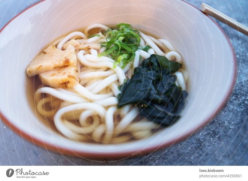 Bowl with japanese Ramen with Udon noodles and bamboo food soup bowl lunch meal udon asia cuisine delicious gourmet green ramen white hot asian chopsticks dish