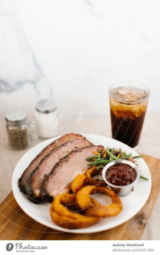 Southern Meal of beef brisket, soda, onion rings and vegetable american background barbecue barbecued barbeque bbq butcher chest roast chuck cooking copy space