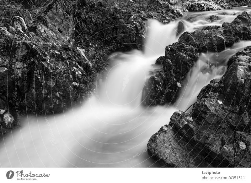 black and white image of beautiful waterfall stunning breathtaking abstract cliff nature river cascade natural outdoor background environment flow beauty rock