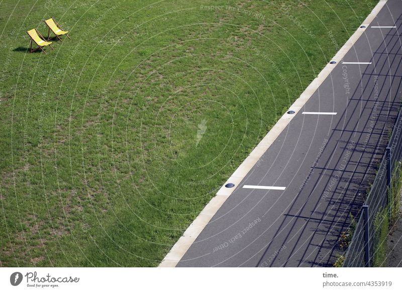 City parking lot deckchairs Meadow Asphalt off mark Fence sunny rest Break Invitation Appealing Whimsical Yellow Public two Bright Park urban