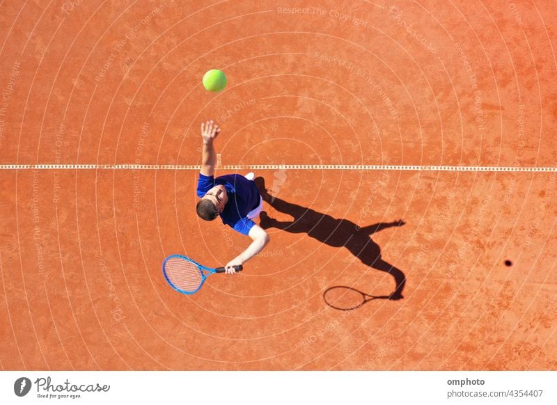 Aerial View of a Tennis Player Serving with Jump Rebound tennis player ball serve rebound court hitting aerial shoot powerful ace win game set competition jump