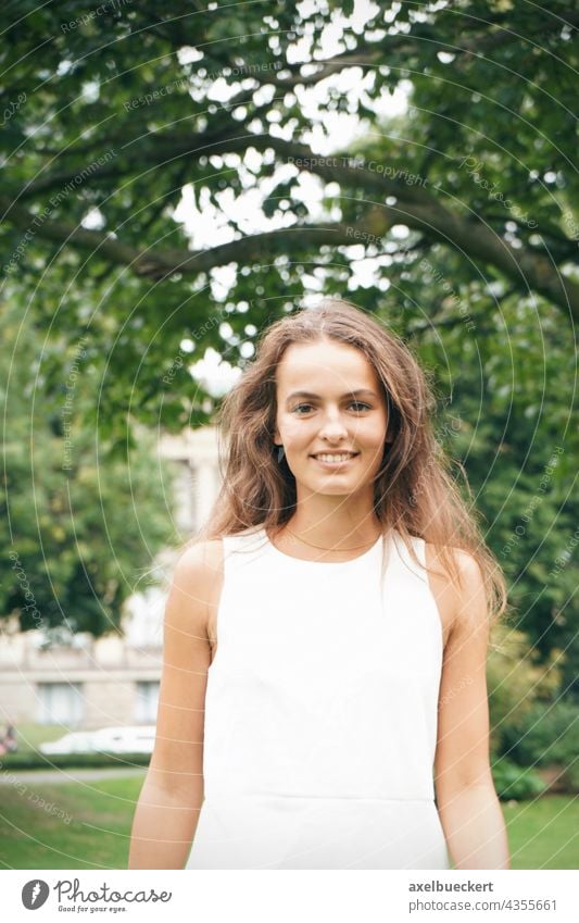 happy young woman in white dress in park fortunate Smiling Young woman real people Woman portrait Lifestyle pretty youthful Attractive Youth (Young adults)