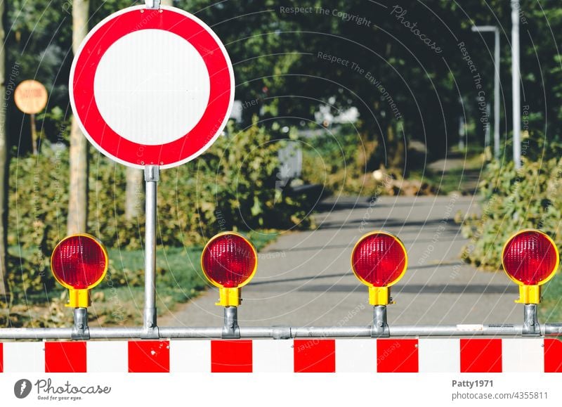 Closed road with no through road sign and barrier cordon Transit prohibited street sign Barred off Signs and labeling Barrier Deserted Reddish white