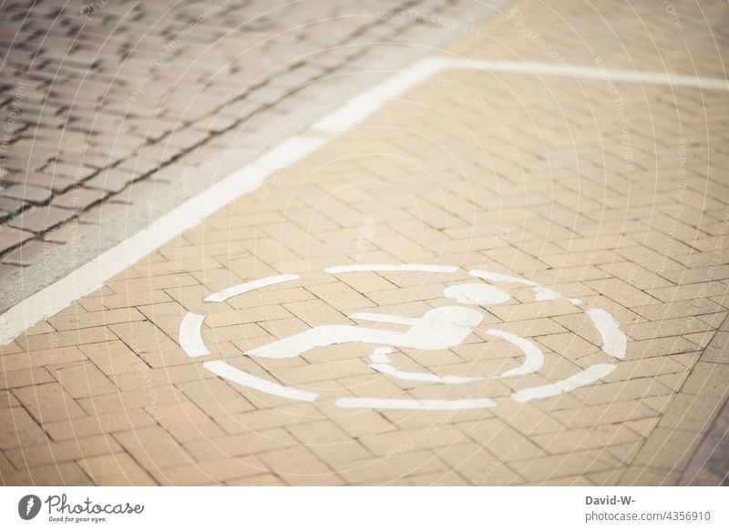 Wheelchair user symbol in a parking area for physically impaired persons physical limitation Parking lot wheelchair users Disability friendly Sign Solidarity