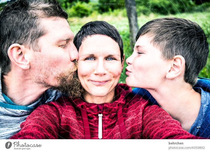 busy | cheeks, heart and love Laughter Smooth Facial hair Close-up Contrast Light Day Warm-heartedness Couple contented Kissing Caresses Emotions tender contact