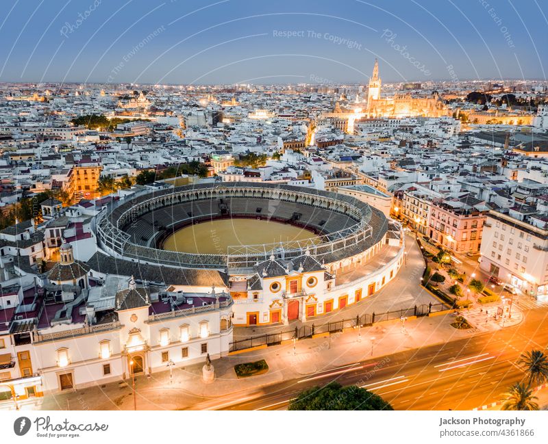 Bullring of the Real Maestranza de Caballería in Sevilla at night, Andalusia, Spain sevilla spain bullring architecture landmark cityscape houses skyline drone