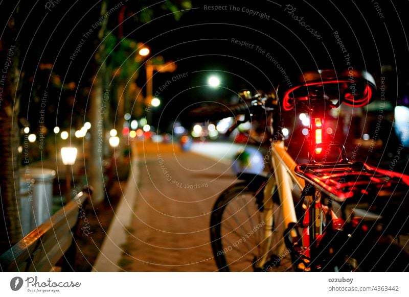 bicycle in the side road at night street city transportation outdoor travel bike light urban lifestyle illuminated dark horizontal ride city life cycling