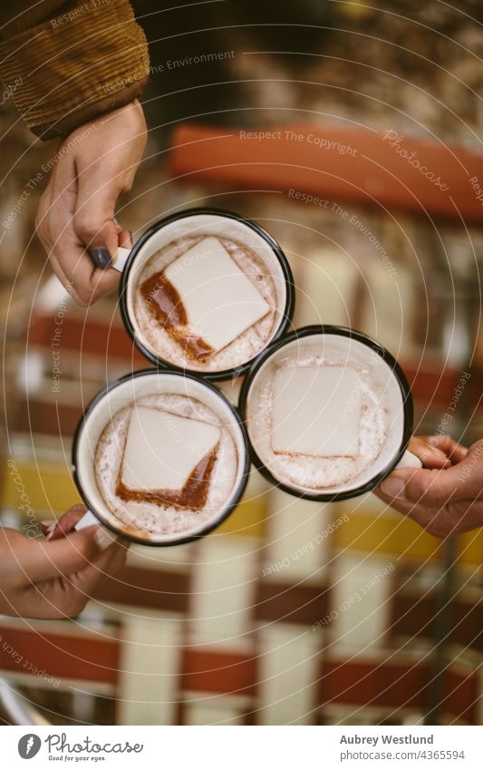 overhead shot of people holding mugs of hot chocolate outdoors blue camping cheers community cook cookware culinary enamel enamelware food group heat home made