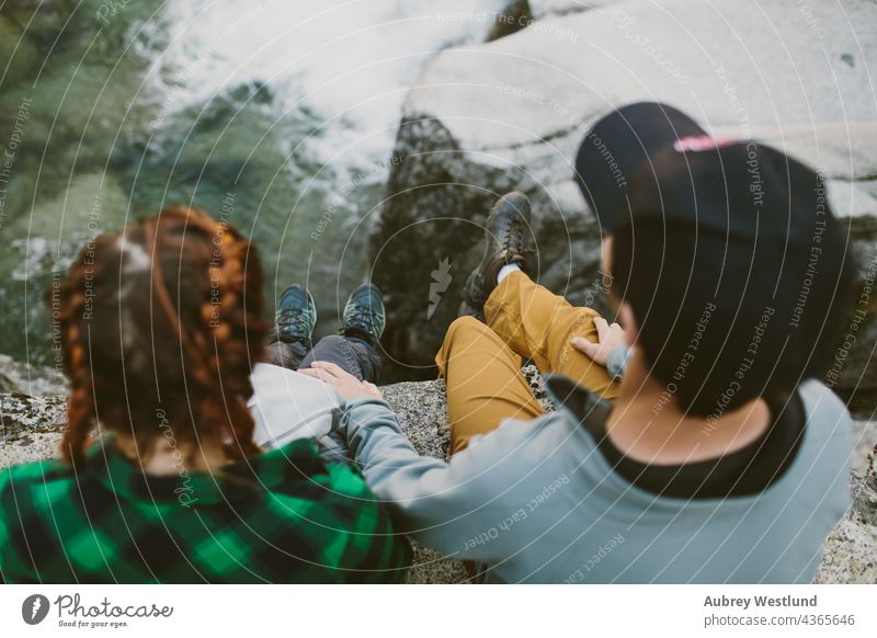 man and woman overlooking waterfall adults america california couple cuddle culture destination exploration explore exploring forest fresh giant hiker hiking