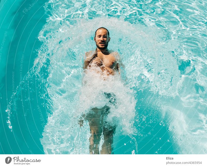 Man cools off in blue water of pool cooling be afloat Summer swimming pools Wet Blue Water light blue Turquoise Refreshment Vacation & Travel Human being