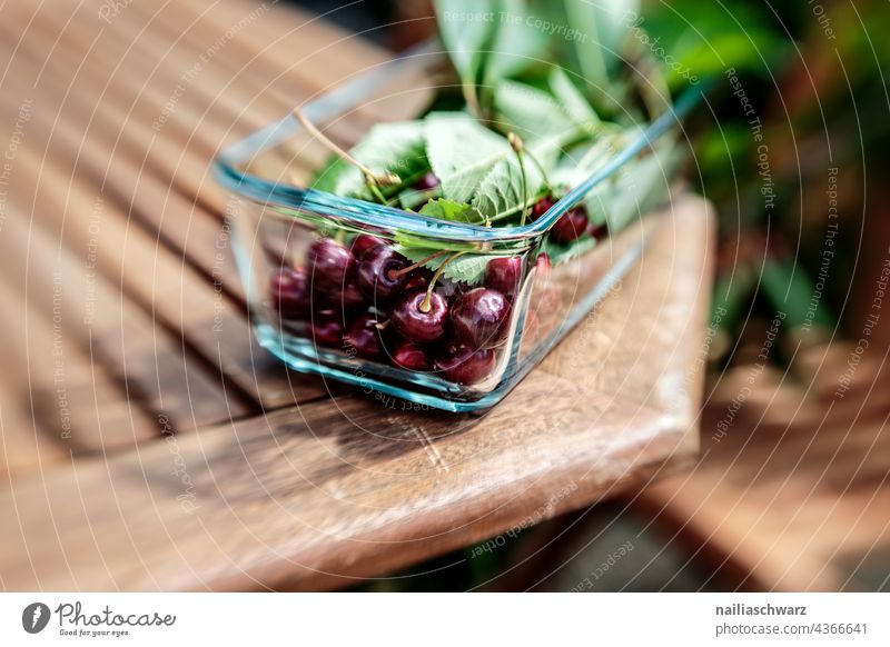 cherries Pick cherries Cherry Red Bowl Garden Garden table Delicious Juicy juicy fruit Summer Harvest Green Mature cherry Nutrition Vegetarian diet Close-up