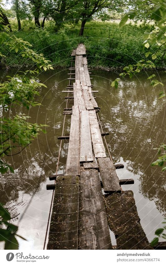 Old wooden bridge, wooden bridge across a small river, bridge with nature. forest landscape path water architecture background beautiful environment natural old