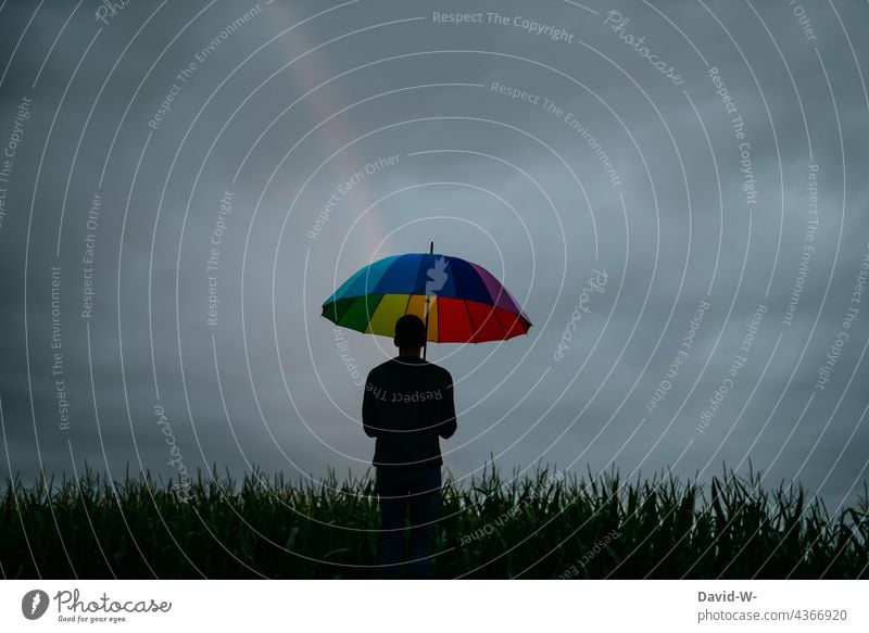 Glimmer of hope for improvement - Rainbow Freedom Hope concept glimmer of hope variegated variety Bright spot Belief symbol Life Future Umbrella Gray