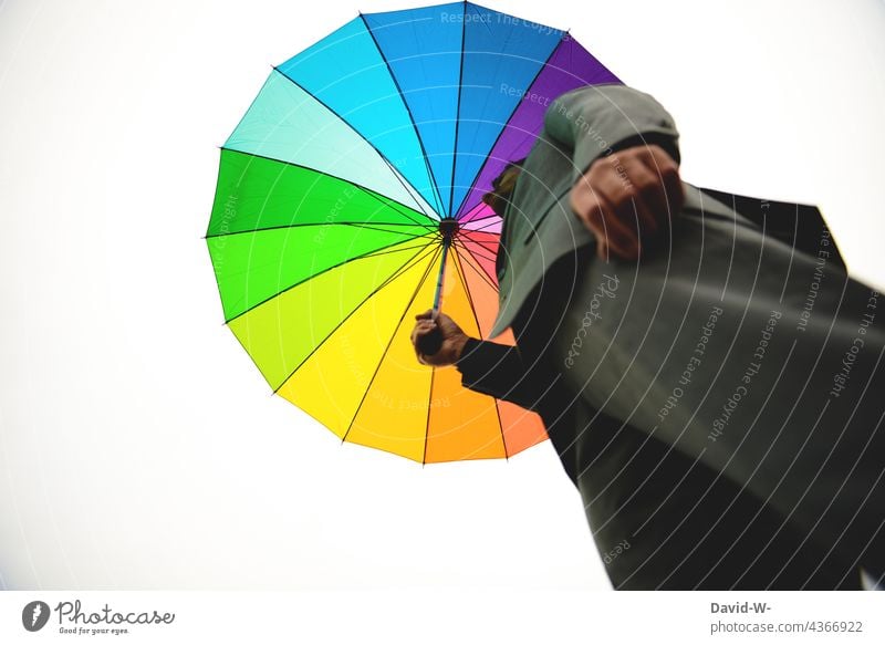 Man in grey suit with colorful umbrella Suit Alternative Opposites variegated Gloomy Umbrella Play of colours Colour palette Life Creativity Pattern Design