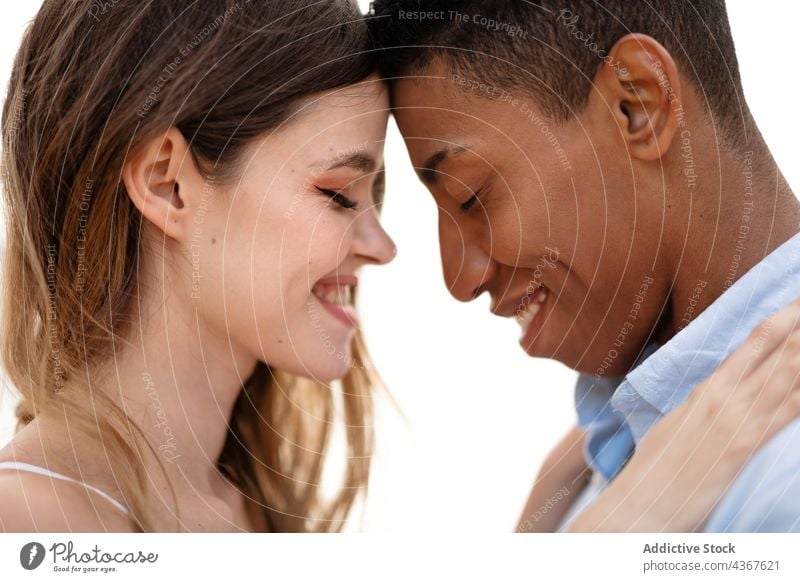 Gentle multiethnic newlyweds embracing on hill on seashore couple beach embrace love wedding bride groom multiracial diverse black african american relationship