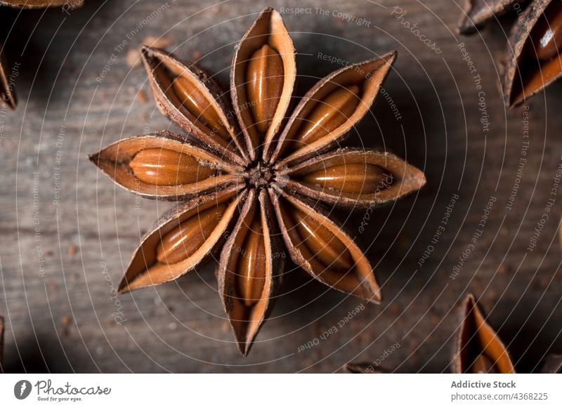 Anise stars on wooden table anise aroma spice seed background natural food rustic healthy aromatic dried organic ingredient cuisine product culinary gastronomy