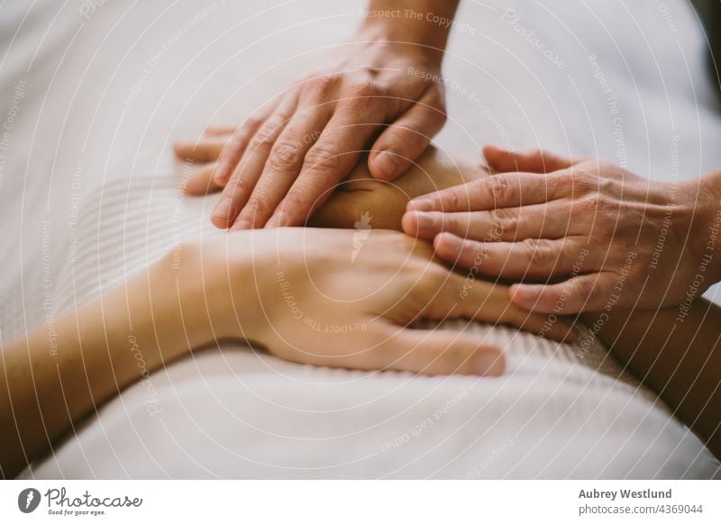 hands during a massage 25-30 30-35 35-39 adult back balance calm exercise female healing health healthy lifestyle indoor life coach massage therapist massaging