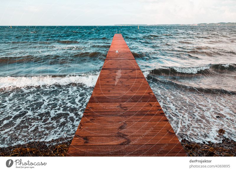 Footbridge leading into the sea in Sonderburg in Denmark Experiencing nature Joie de vivre (Vitality) Subdued colour Abstract Pattern Structures and shapes