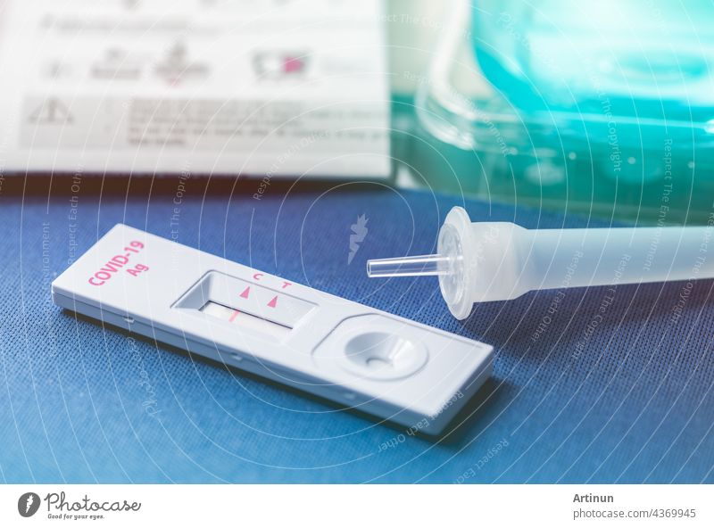 Covid 19 antigen self test for nasal swab with positive result. Antigen test kit for home use to detection coronavirus infection. Negative test result from rapid antigen test. Coronavirus diagnosis.