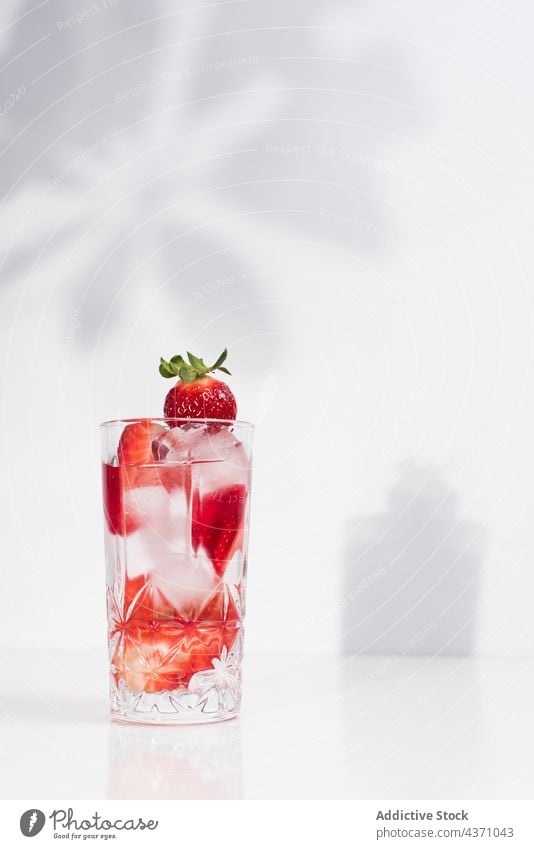 Detox drink with fresh strawberry infuse water detox cold glass summer beverage natural refreshment delicious tasty minimal simple vitamin healthy liquid serve